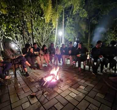 Team enjoying a bonfire during a night outing